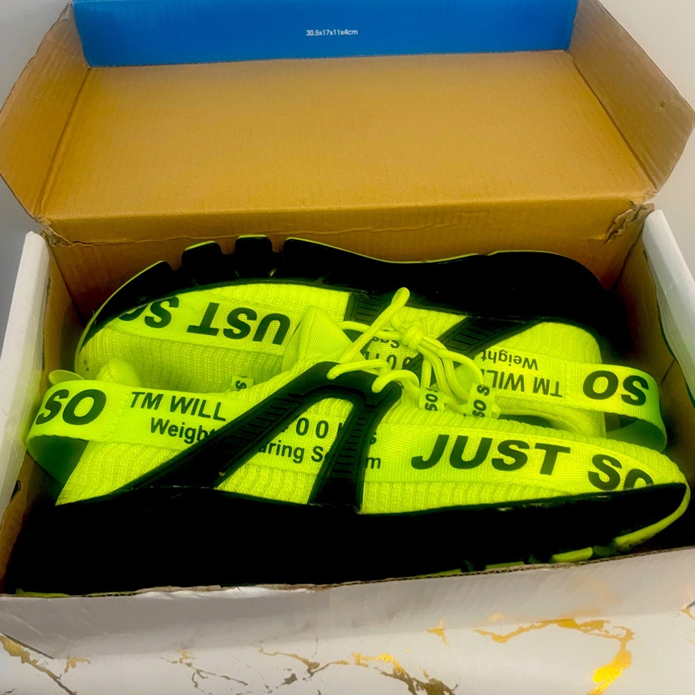 Green and black sneakers